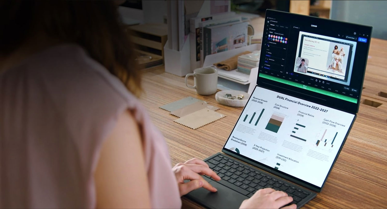 ASUS Zenbook DUO wykorzystywany do zadań związanych z produktywnością. Górny ekran wyświetla wykresy i diagramy, natomiast dolny ekran pokazuje dodatkowe panele danych.